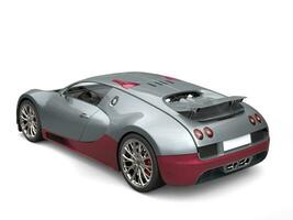 Metallic gray modern super sports car with dark red metallic details - top tail view photo