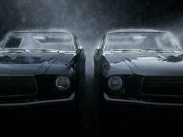 Two awesome black vintage muscle cars side by side in the rain photo