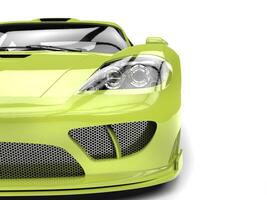 Fresh lime green modern super car - front view closeup cut shot photo