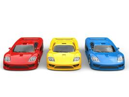 Red, yellow and blue concept super sports cars - top front view photo