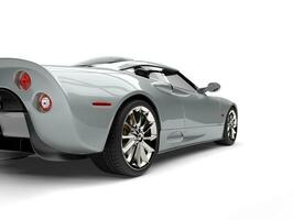 Modern silver super sports car - tail view cut shot photo