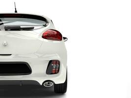 Sublime white modern electric car - tail view cut shot photo