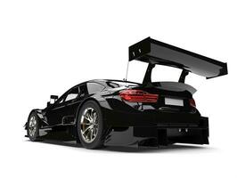 Shiny midnight black modern super race car - rear wing shot photo