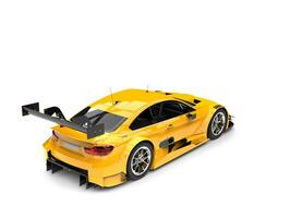 Cadmium yellow modern super car - rear side view photo