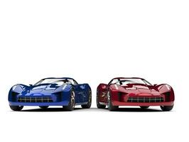 Metallic blue and red super sports concept cars - side by side photo