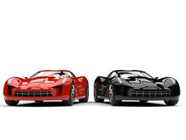 Raging red and midnight black super sports cars - side by side photo