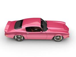 Metallic pink restored vintage American car - top down side view photo