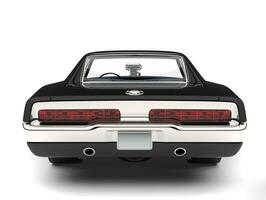 Pitch black American vintage muscle car - back view closeup shot photo