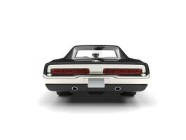 Pitch black American vintage muscle car - back view photo