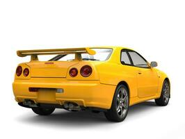 Bright yellow modern urban sports car - tail view photo