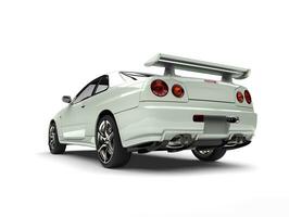 Milk white urban sports car - tail view photo