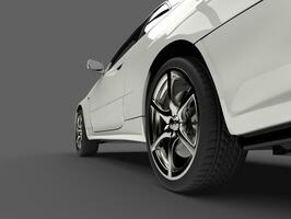 Show white urban sports car - rear wheel closeup shot photo
