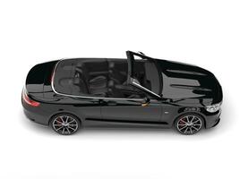 Night black modern luxury convertible car - top down side view photo