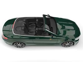 Dark green modern luxury convertible car - top down side view photo