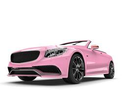 Pretty pink modern luxury convertible car - low angle shot photo
