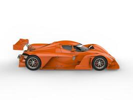 Smoking orange modern super sports car - top down side view photo