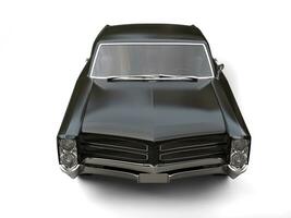 Slick black vintage car - top down front view photo