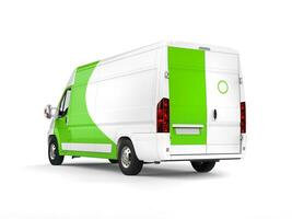 Big white delivery van with green details - rear side view photo