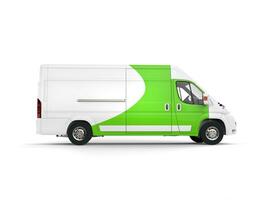 Big white delivery van with green details - side view photo