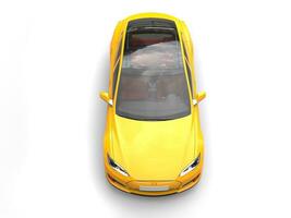 Summer sun yellow electric sports car - top down view photo