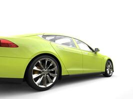 Mad lime green modern electric sports car - rear wheel closeup shot photo