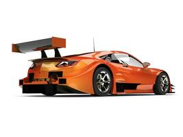 Orange pearlescent modern super sports car - back view photo
