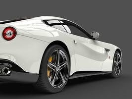 Shiny modern white fast concept car - rear wheel closeup shot photo