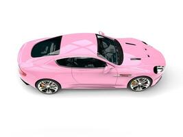 Baby pink modern luxury sports car - top down side view photo