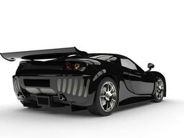 Night black modern race super car - back side view photo