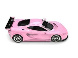 Cherry blossom pink modern sports super car - top down view photo