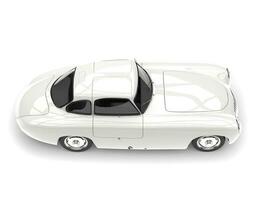 Old vintage clear white sports car - top down side view photo