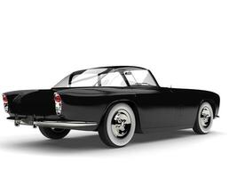 Night black vintage muscle car with white wall tires - back view photo