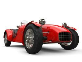 Bright red vintage open wheel sport racing car - low angle closeup shot photo