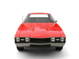 Restored old school red vintage muscle car - front view closeup shot photo