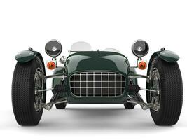 Deep green vintage open wheel sports racing car - front view closeup shot photo