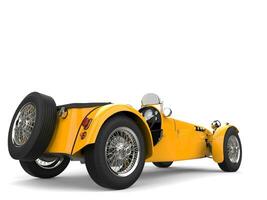 Sun yellow vintage open wheel sports racing car - rear view photo