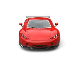 Bright red modern concept supercar - front view photo