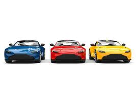 Red, blue and yellow modern electric sports cars parked side by side photo