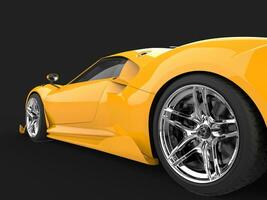 Bright yellow modern luxury sports car - rear wheel closeup shot photo