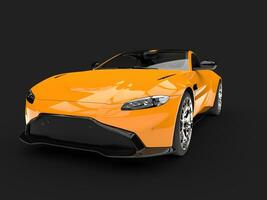 Modern bright orange luxury sports car - front view closeup shot photo