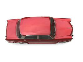 Metallic cherry red vintage compact car - top down view photo