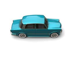 Restored vintage compact car with  shiny metallic blue color paint - top down view photo