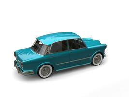Restored vintage compact car with  shiny metallic blue color paint - back side view photo