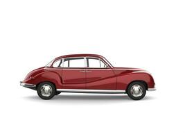 Old vintage metallic cherry red luxury car - side view photo