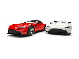 Red and white modern electric sports cars side by side photo