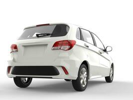 White modern compact car - rear view photo