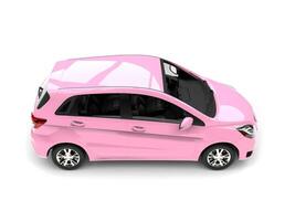 Modern small compact cars in fabulous pink color - top down view photo