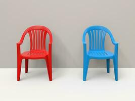 Red and blue plastic chairs side by side photo