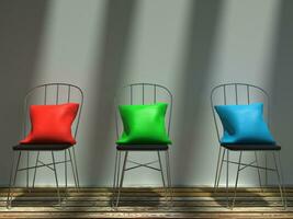 Sunlit red, green and blue cushions on metal chairs photo