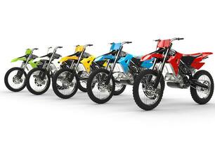 Row of motocross bikes isolated on white background photo